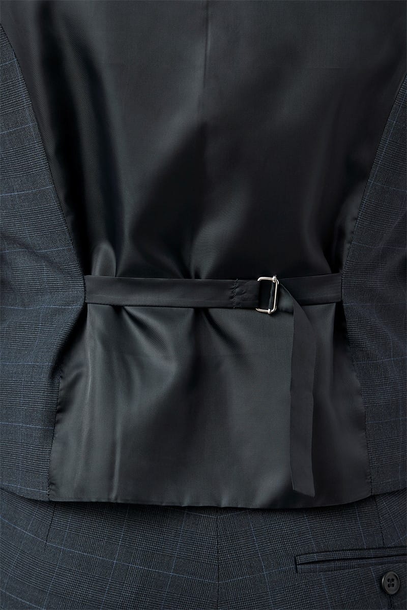 Close-up of a dark gray suit jacket with a pocket and belt buckle.