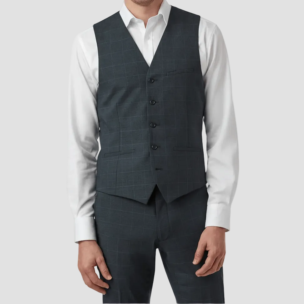 Man wearing a dark navy checkered vest over a white shirt on a white background