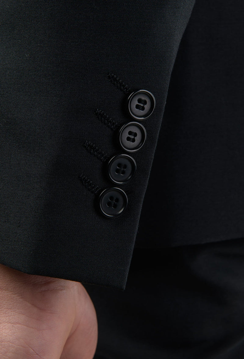 a close up of the sleeve button detailing of the Aston slim fit colton suit in black pure wool A0137122S