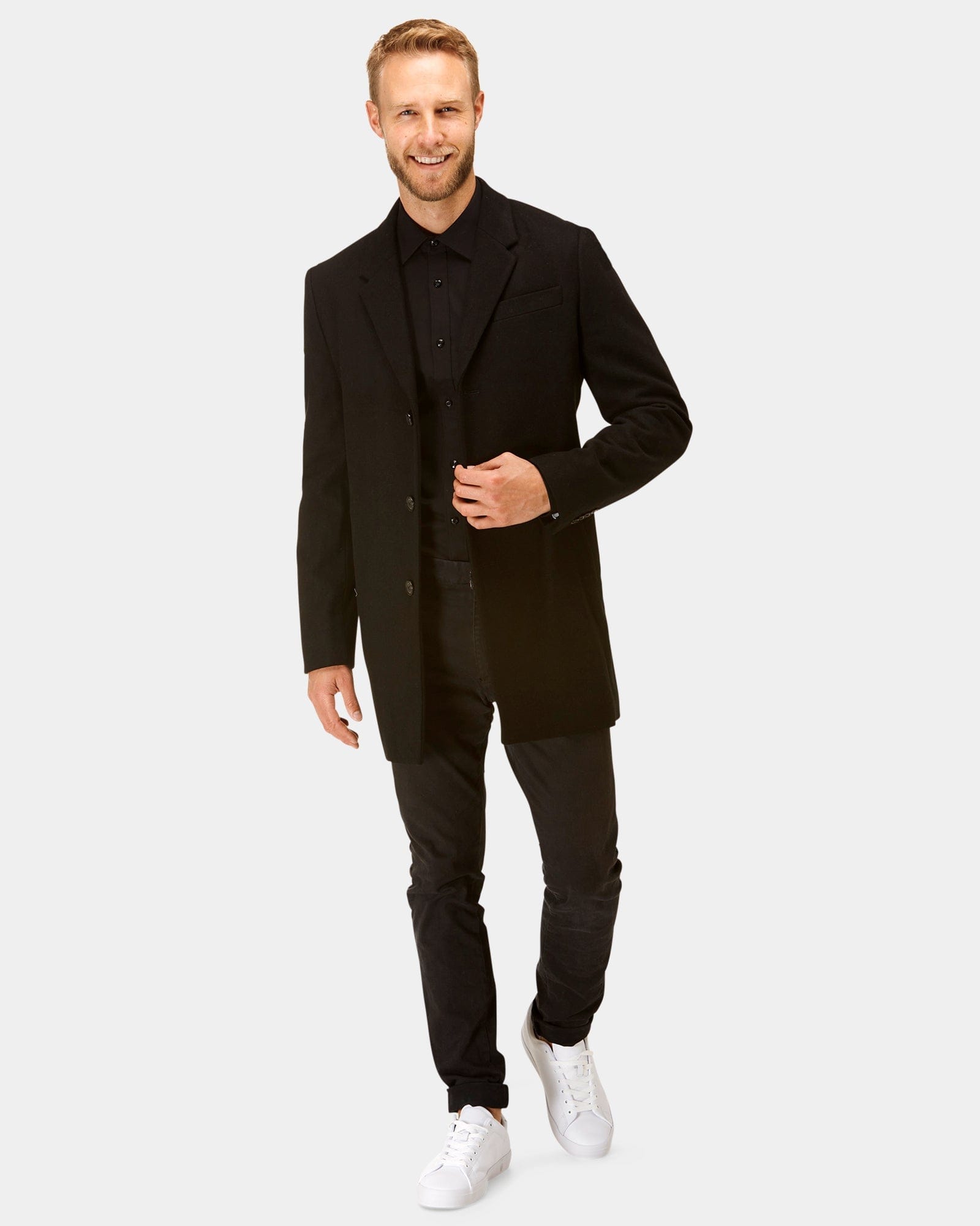 a man wears an all black outfit by brooksfield shirts
