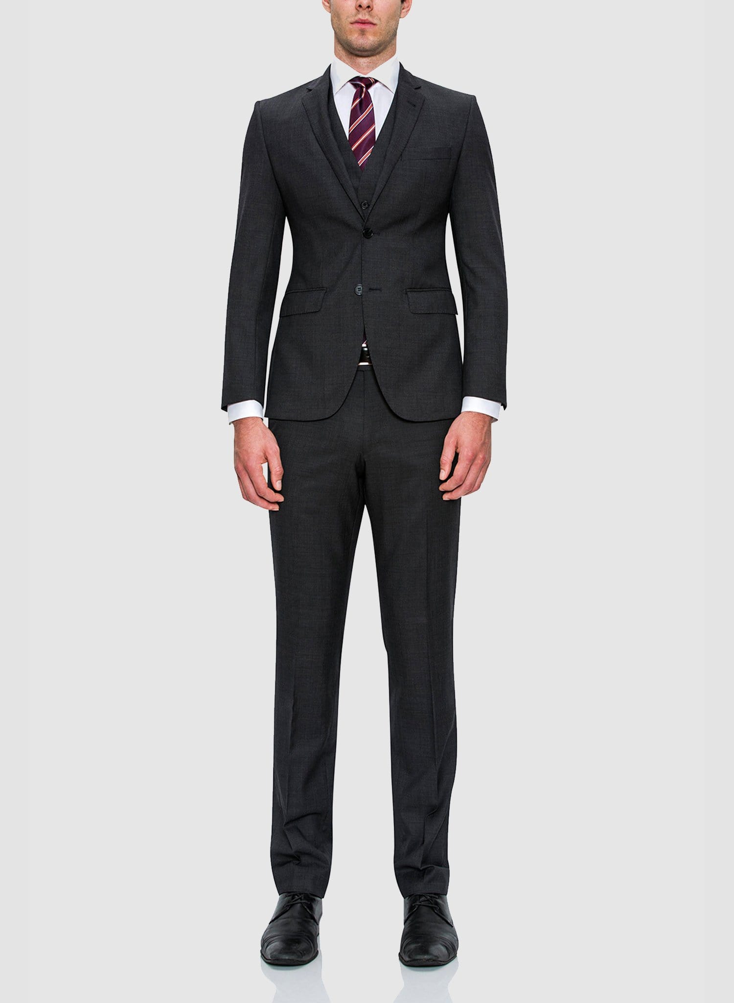 A model wearing the cambridge classic fit interceptor trouser in charcoal pure wool F2800, styled with the matching jacket