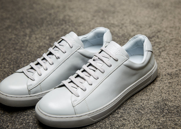 a close view of the mavericks cooper grey mens leather dress sneaker with mavericks embossed on the tongue
