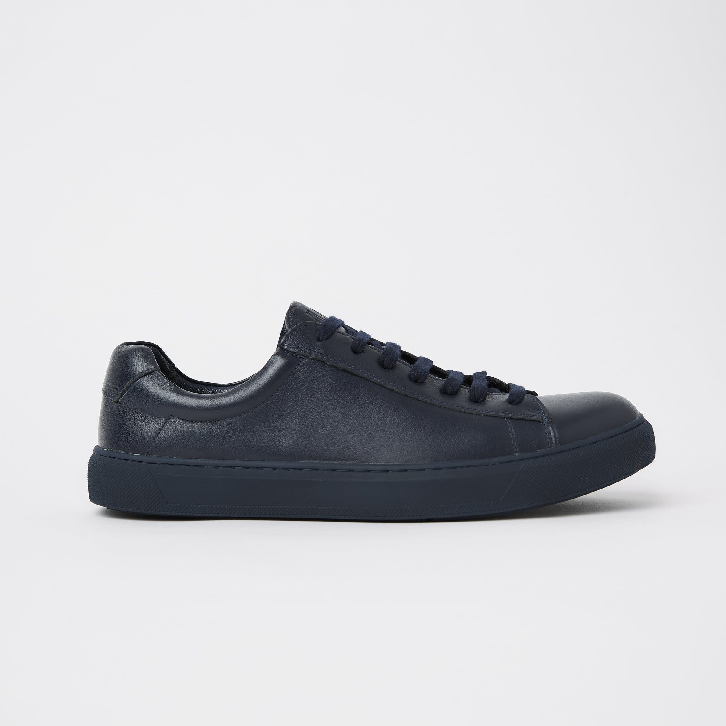 mavericks cooper mens leather sneaker in navy blue facing the side