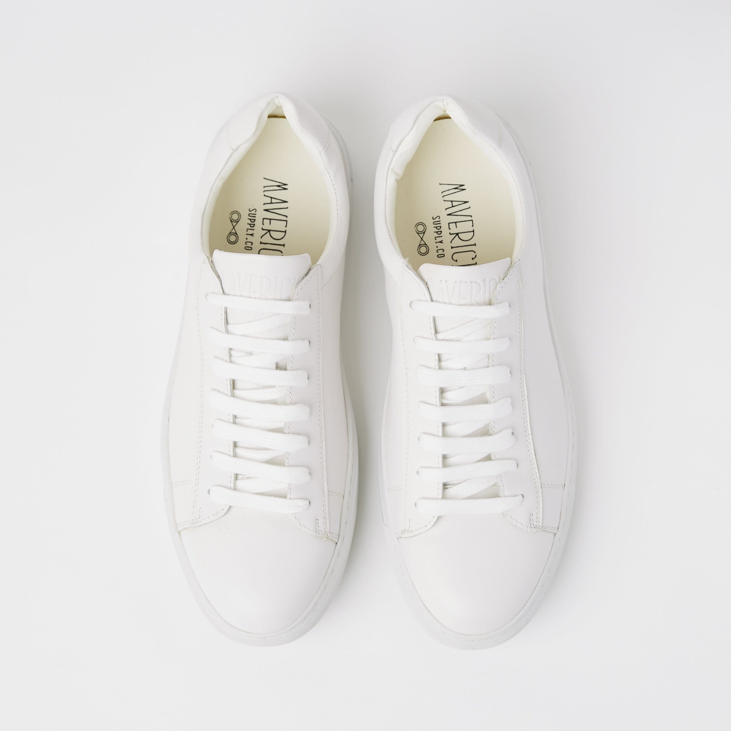 a top view of the mavericks mens white leather sneakers