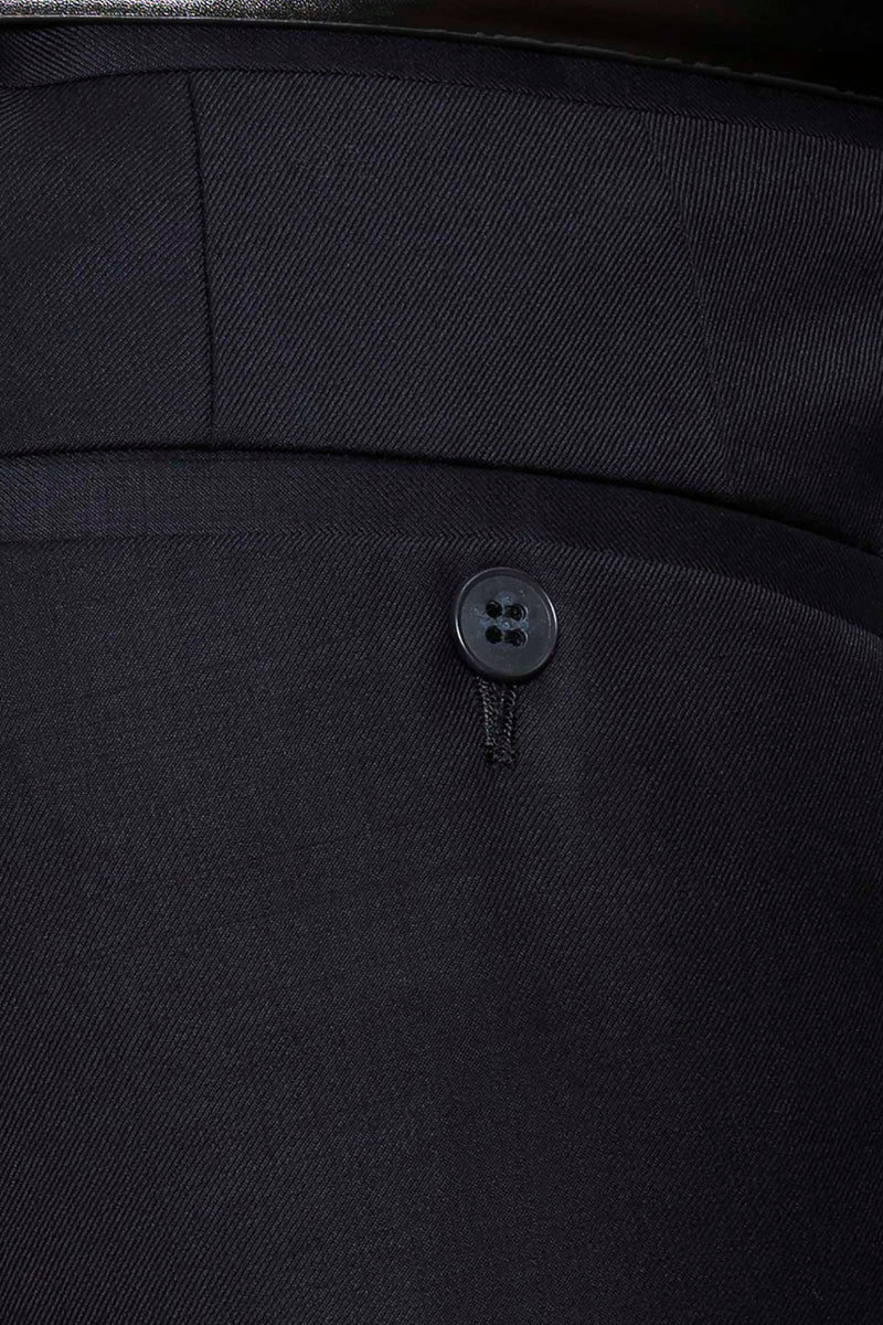 a close up view of the texxtured woven fabric of the caper suit trouser in navy pure wool