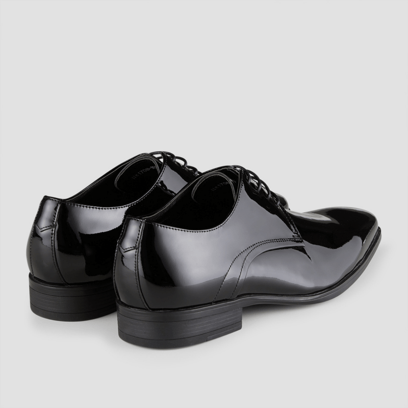The back of the Aquila Aq mens leather patent shoe showing the rubber heel