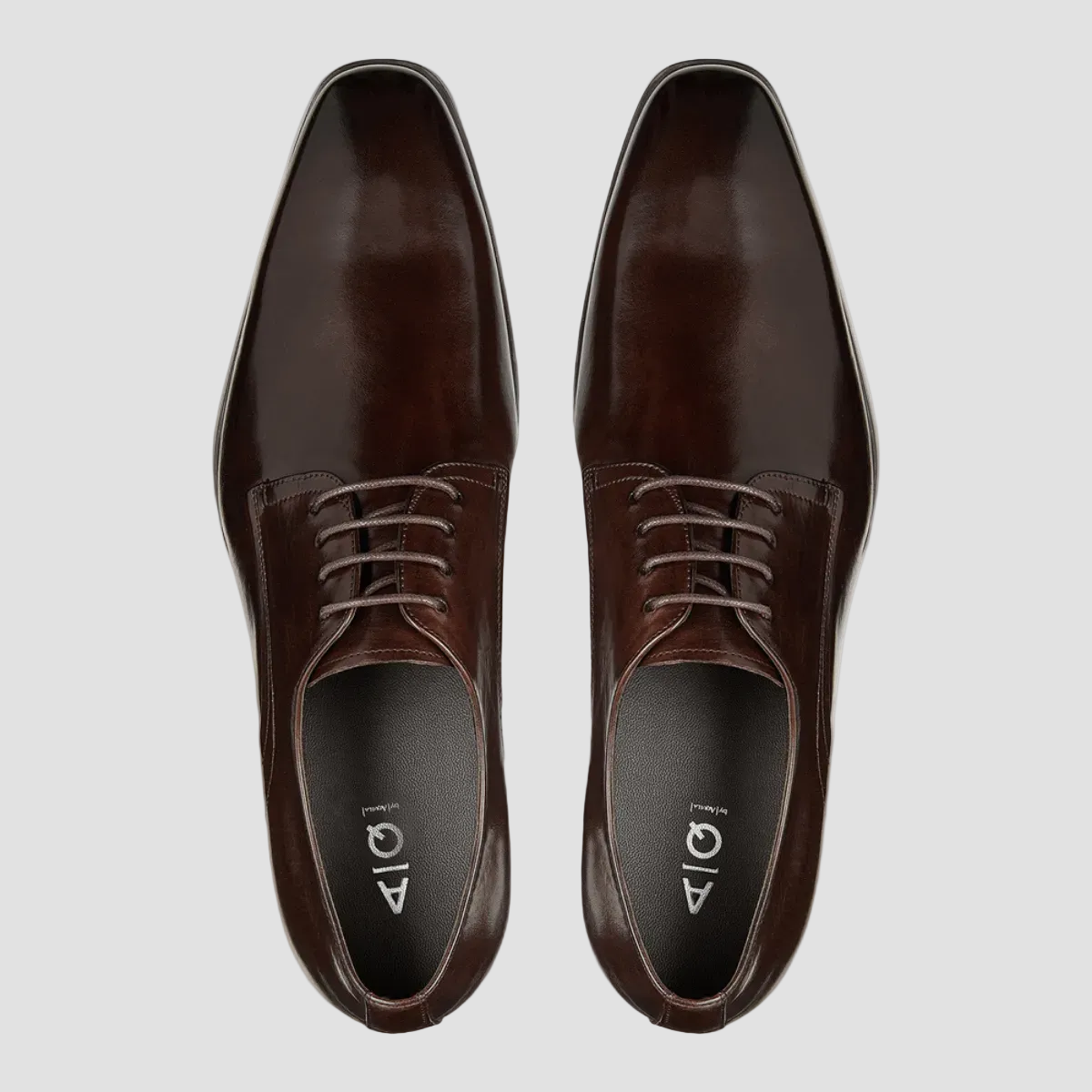 a pair of brown leather shoes from aquila in a smooth shiny finish