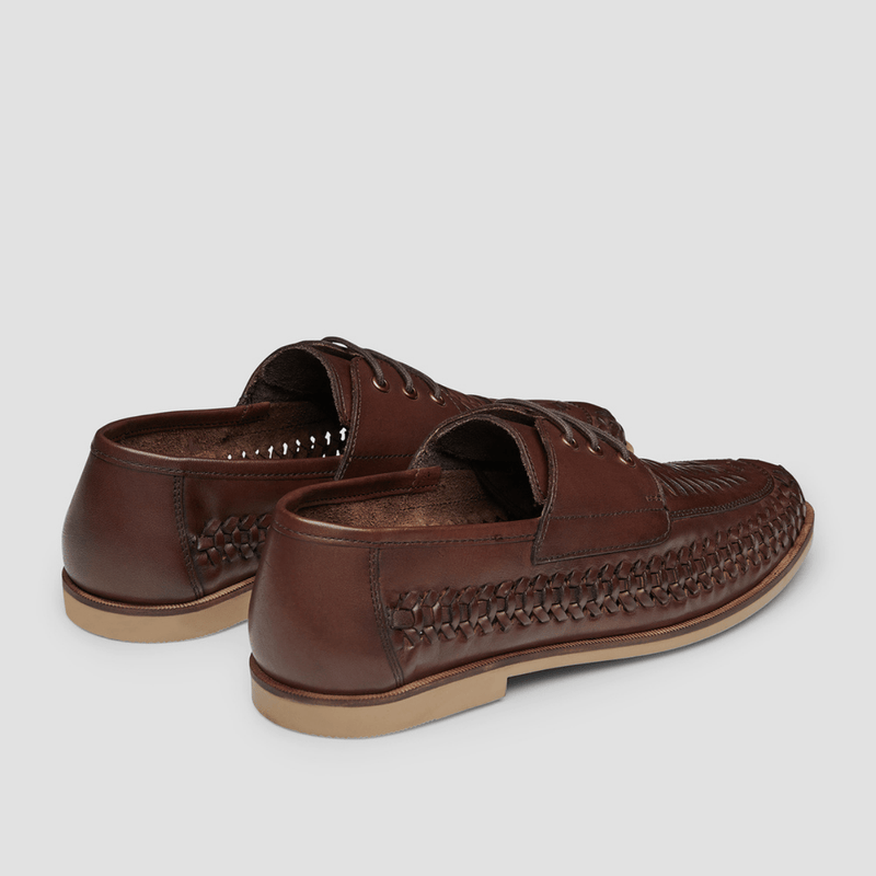 a side on view of the mens brown leather shoe with braided detail 