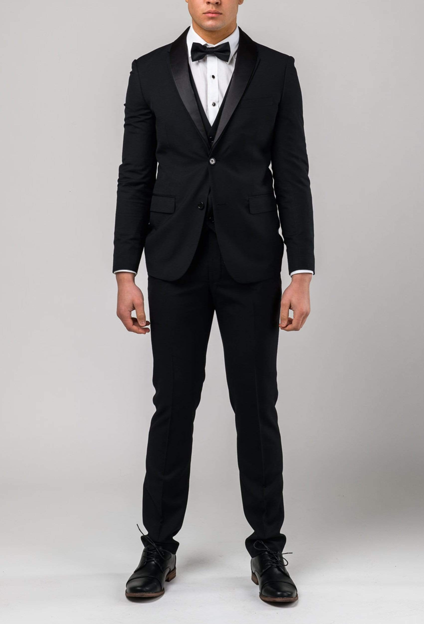 Front view of the Aston slim fit laneport dinner suit in black A019301S styled with a black bow tie and a white shirt