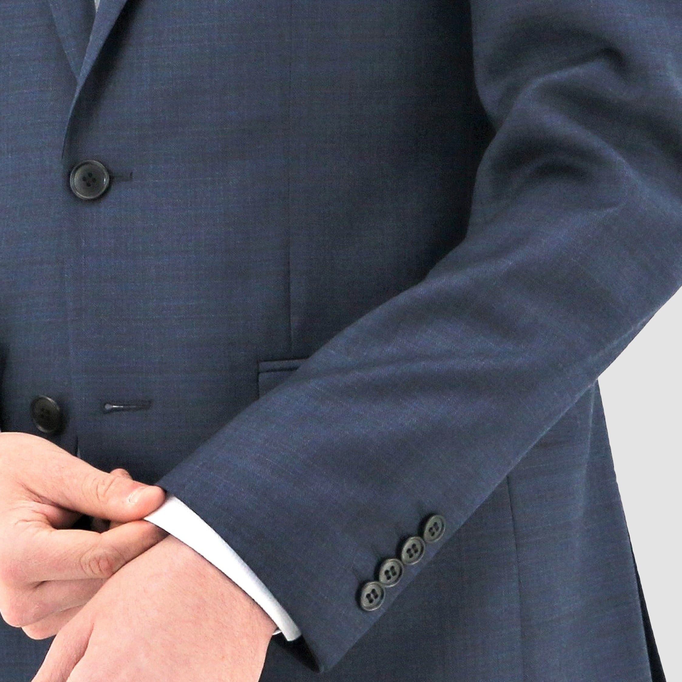 A refined Boston Shape navy slim‑fit suit crafted from breathable merino wool with clean, modern tailoring and Edward trousers.