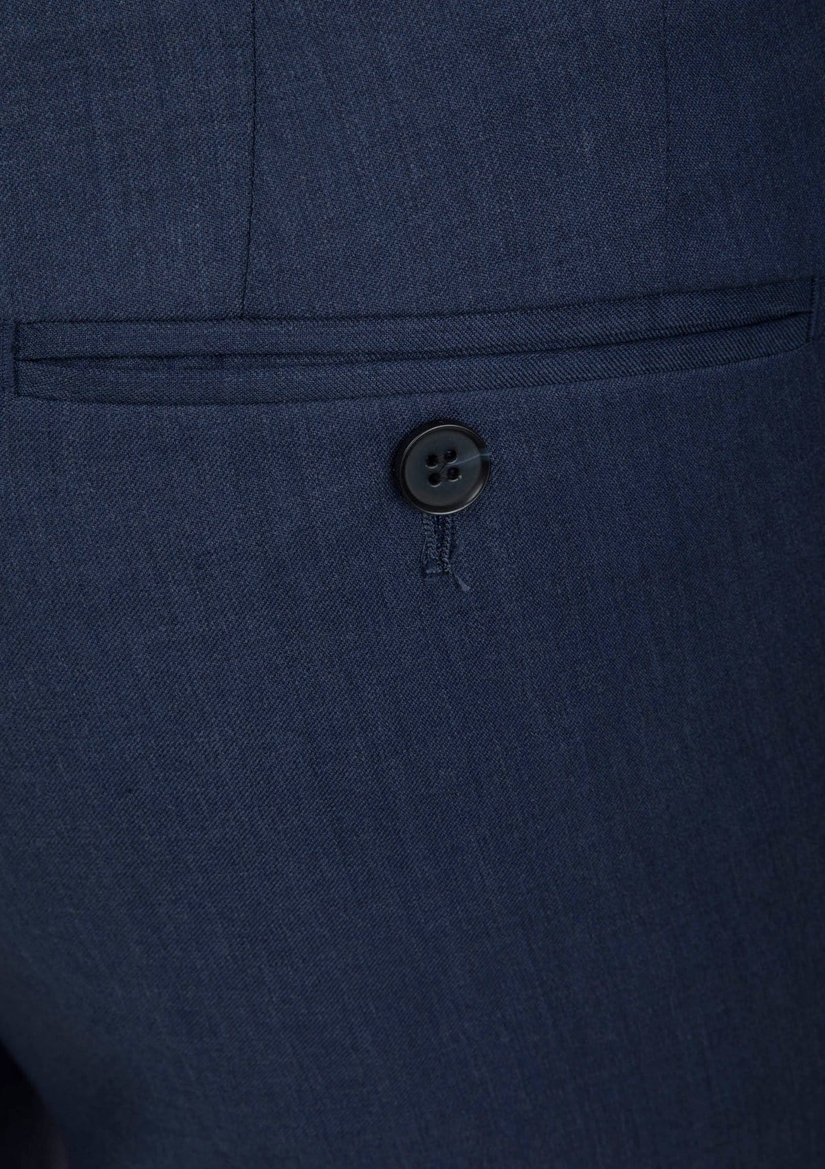 a close up of the back pocket on the cambridge menswear the jett trouser in blue woll blend FCG279