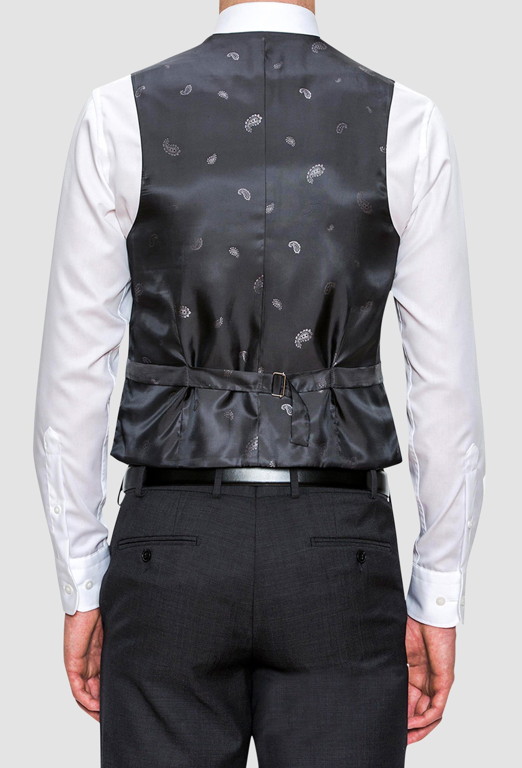 A model wears the Cambridge classic fit beaumont vest in charcoal pure wool F2800 styled with a white shirt, a good view of the tab adjuster at the back
