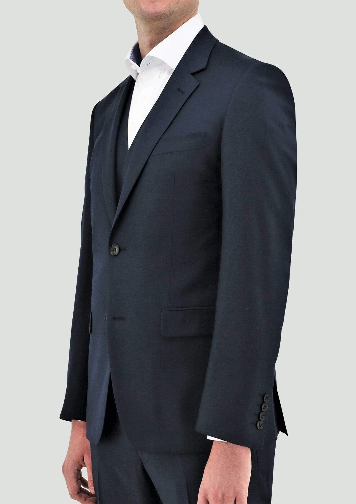 a model wears the Daniel Hechter slim fit shape suit in deep blue pure wool showing the lapel detail and deep blue colour DH106-14