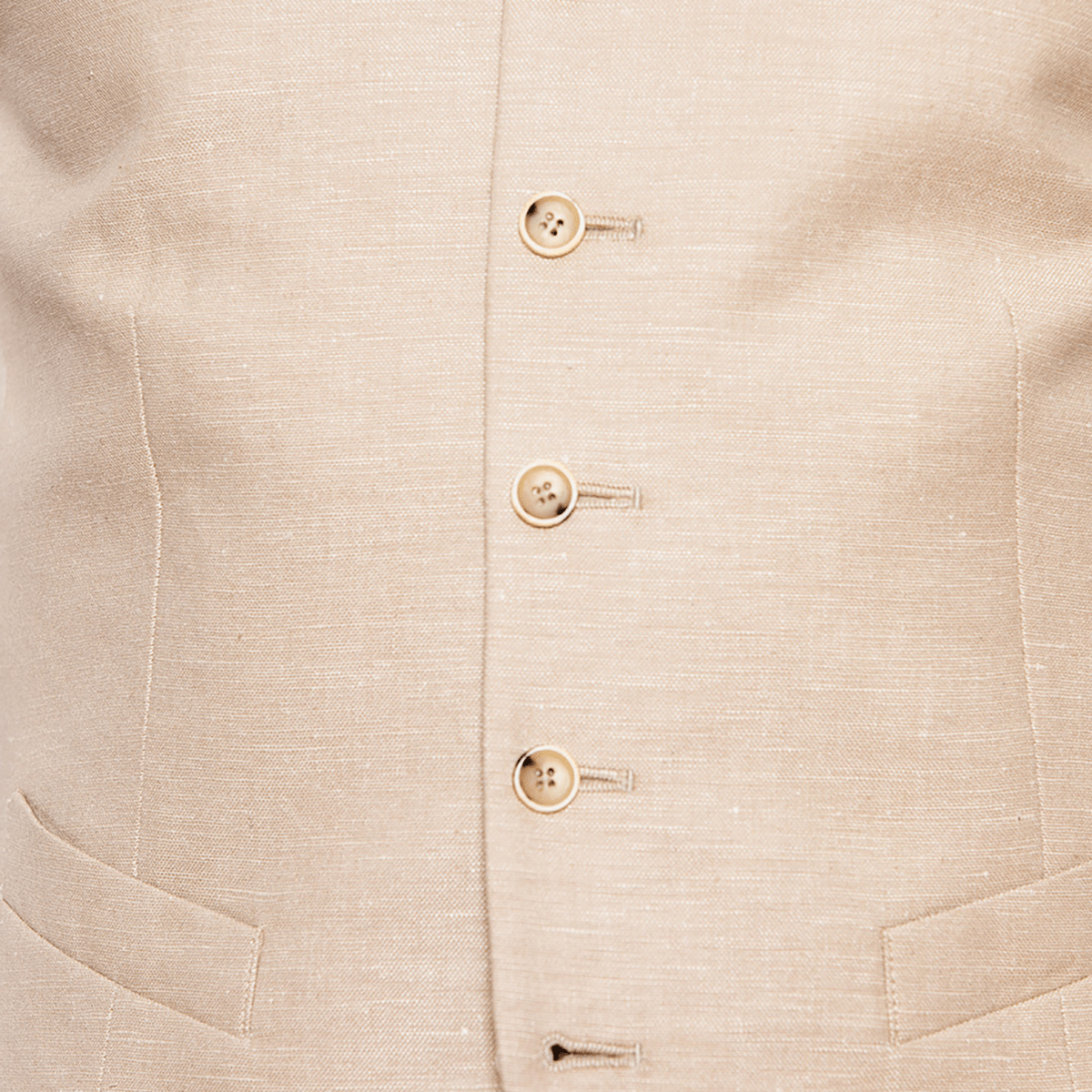 the tortoise shell buttons on the gibson might vest and a sand linen blend