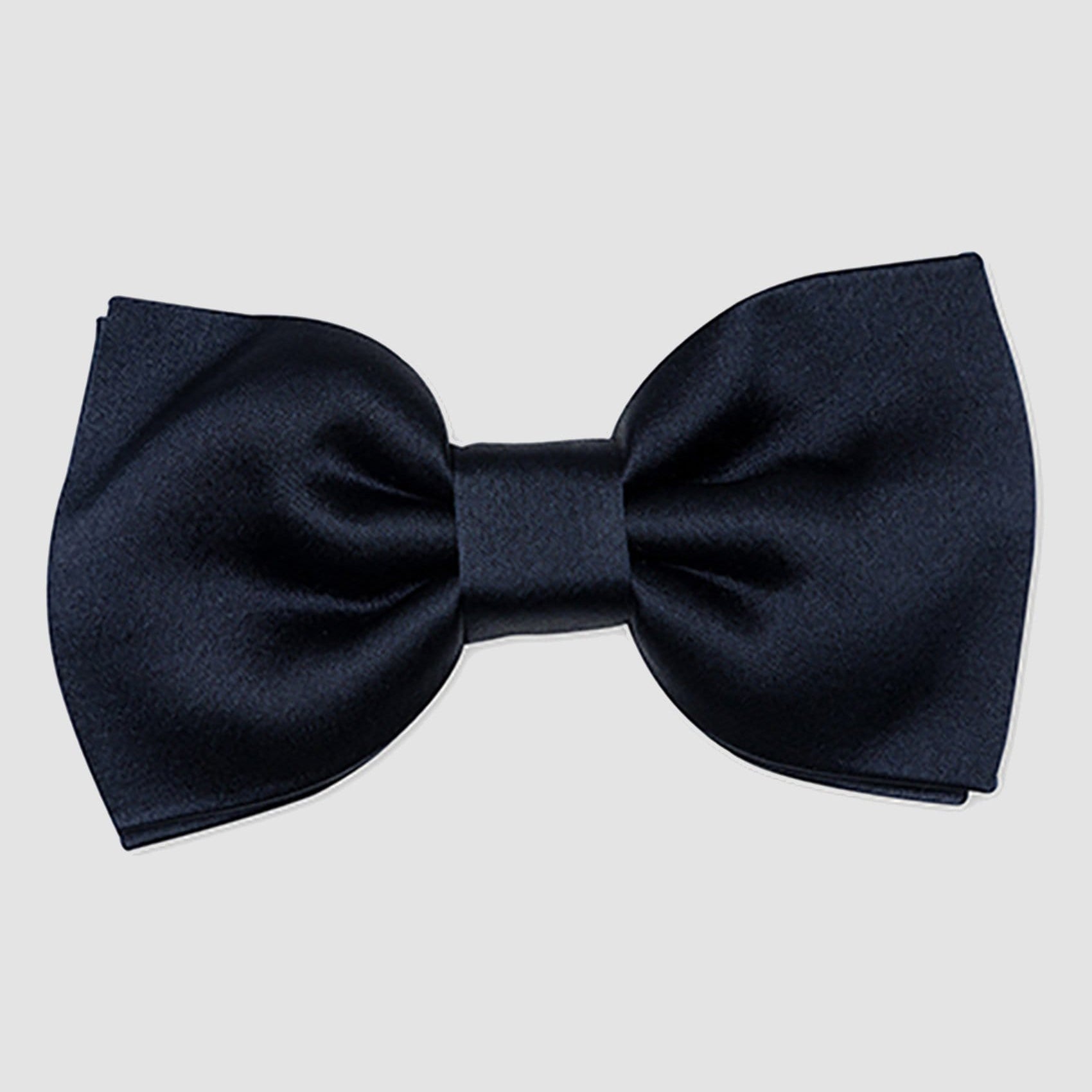 A close up view of the Joe Black classic bow tie in navy PJAY000044 on a grey background