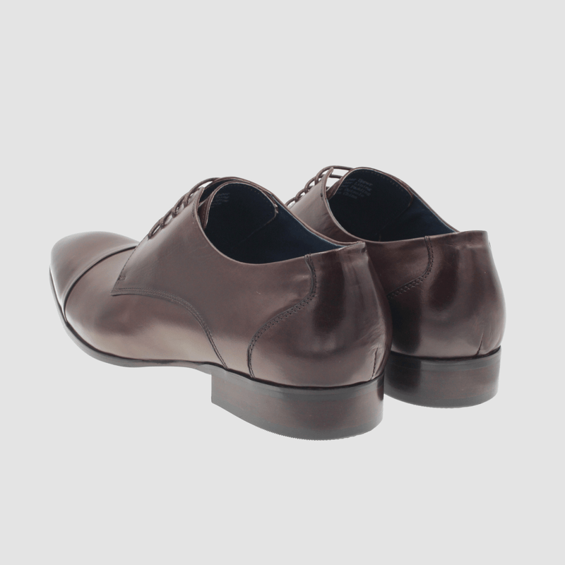 the heel on the mens leather dress shoe in chocolate brown