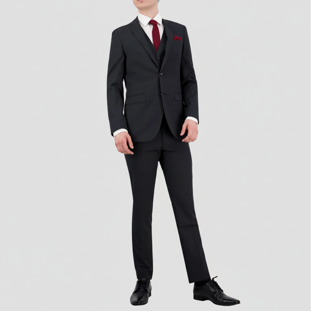 Patterned charcoal mens wool blend suit by Savile Row with a white shirt, maroon tie and pocket square and black leather shoes.