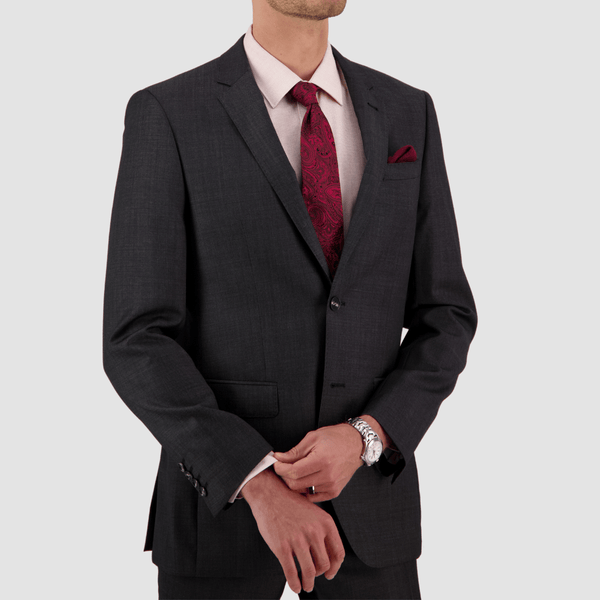close up of the mens charcoal grey abram suit jacket with a pink shirts and red floral tie