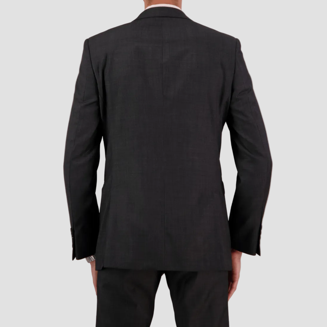 A tailored charcoal textured suit in Super 110’s Merino by Savile Row for comfort and polish.