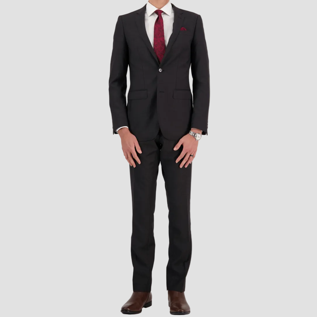 Charcoal travel‑finish wool suit by Savile Row, tailored in Super 110’s Merino for structure and ease.