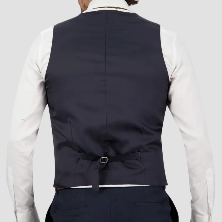 Navy blue Australian merino wool vest with satin back, adjustable tab, paired with matching pants, white shirt and brown leather belt.