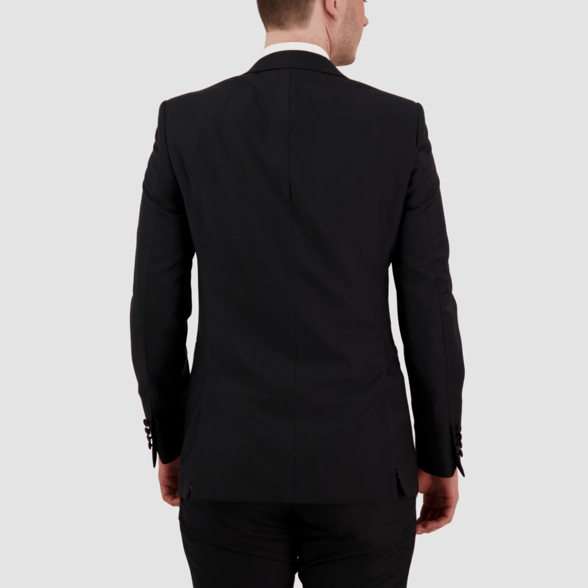 the back of the mens black peak lapel tuxedo in black