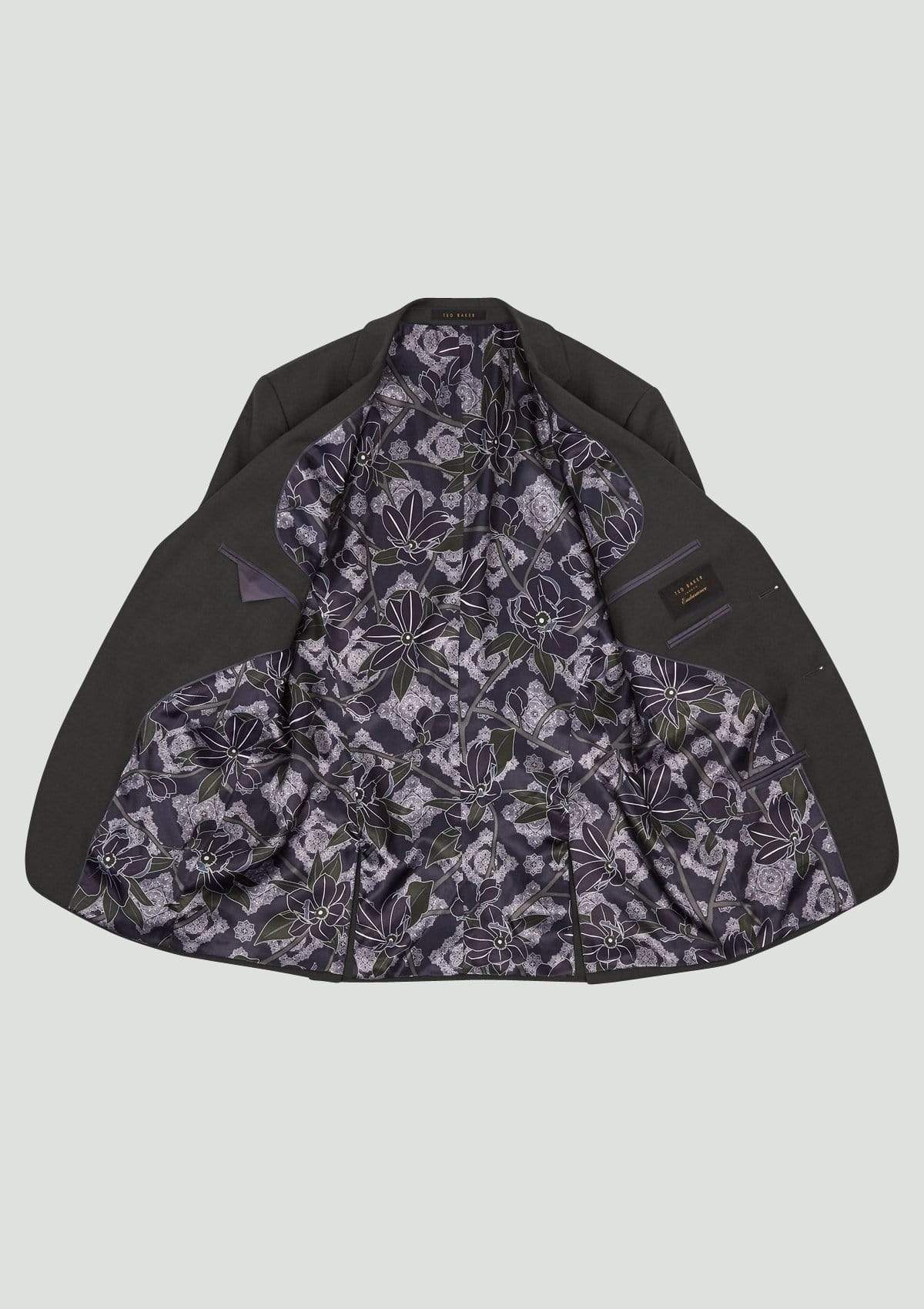 the floral printed lining and hidden pockets in the ted baker elegan suit jacket in black pure wool available at mens suit warehouse