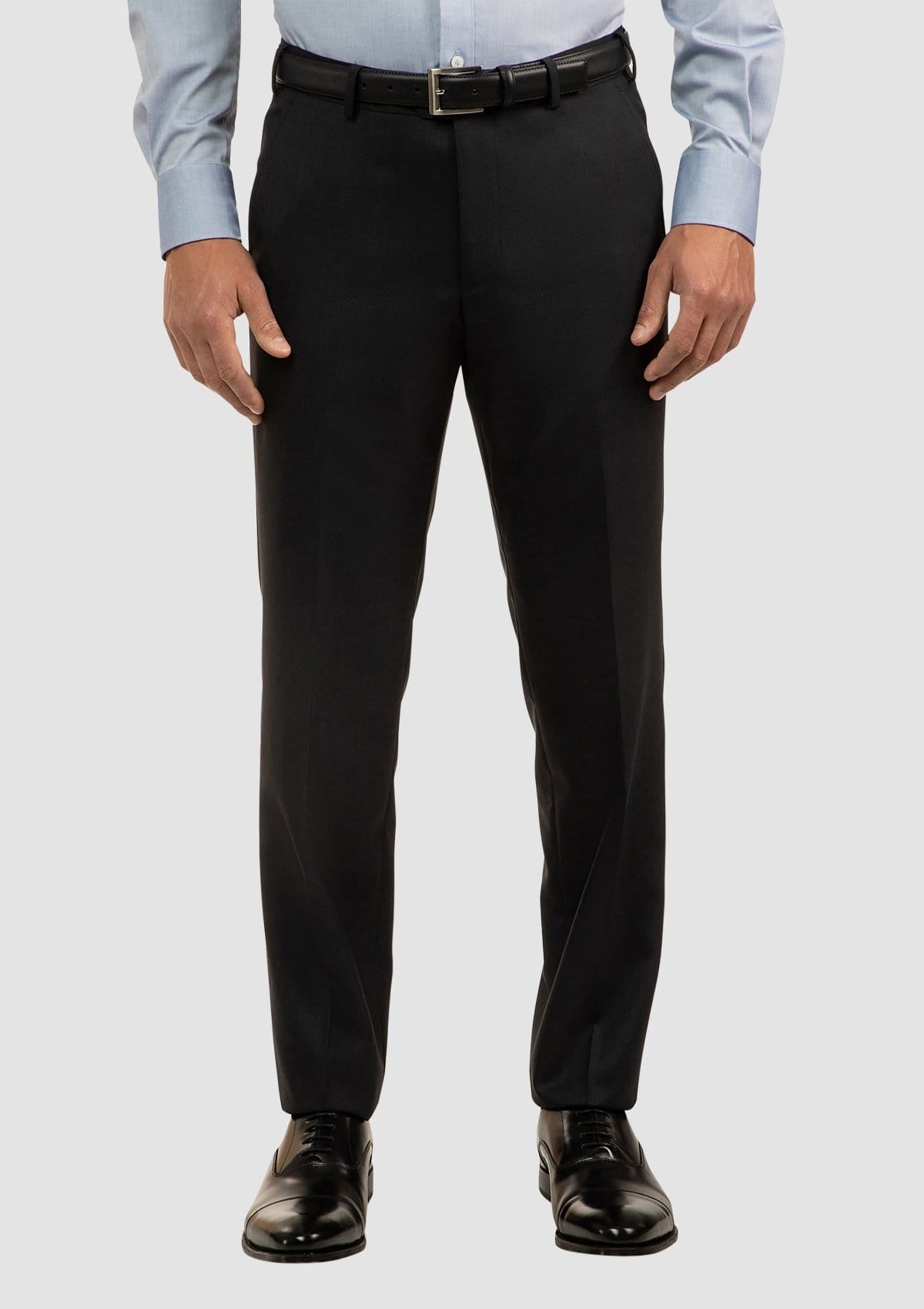 mens suit trouser paired with a blue business shirt and black accessories