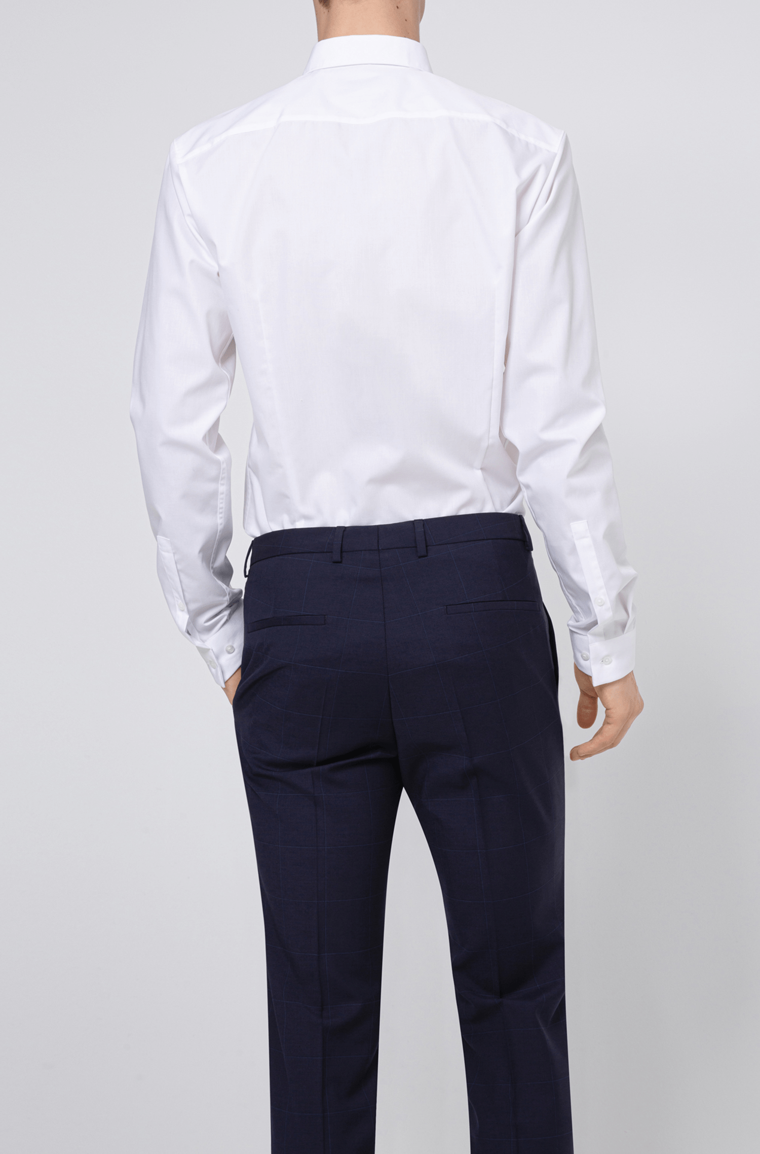 the back view of the on the hugo boss mens arti hesten suit jacket in dark navy pure wool a flatlay image of the slim fit arti hesten hugo boss suit trouser in blue pure wool 50427352