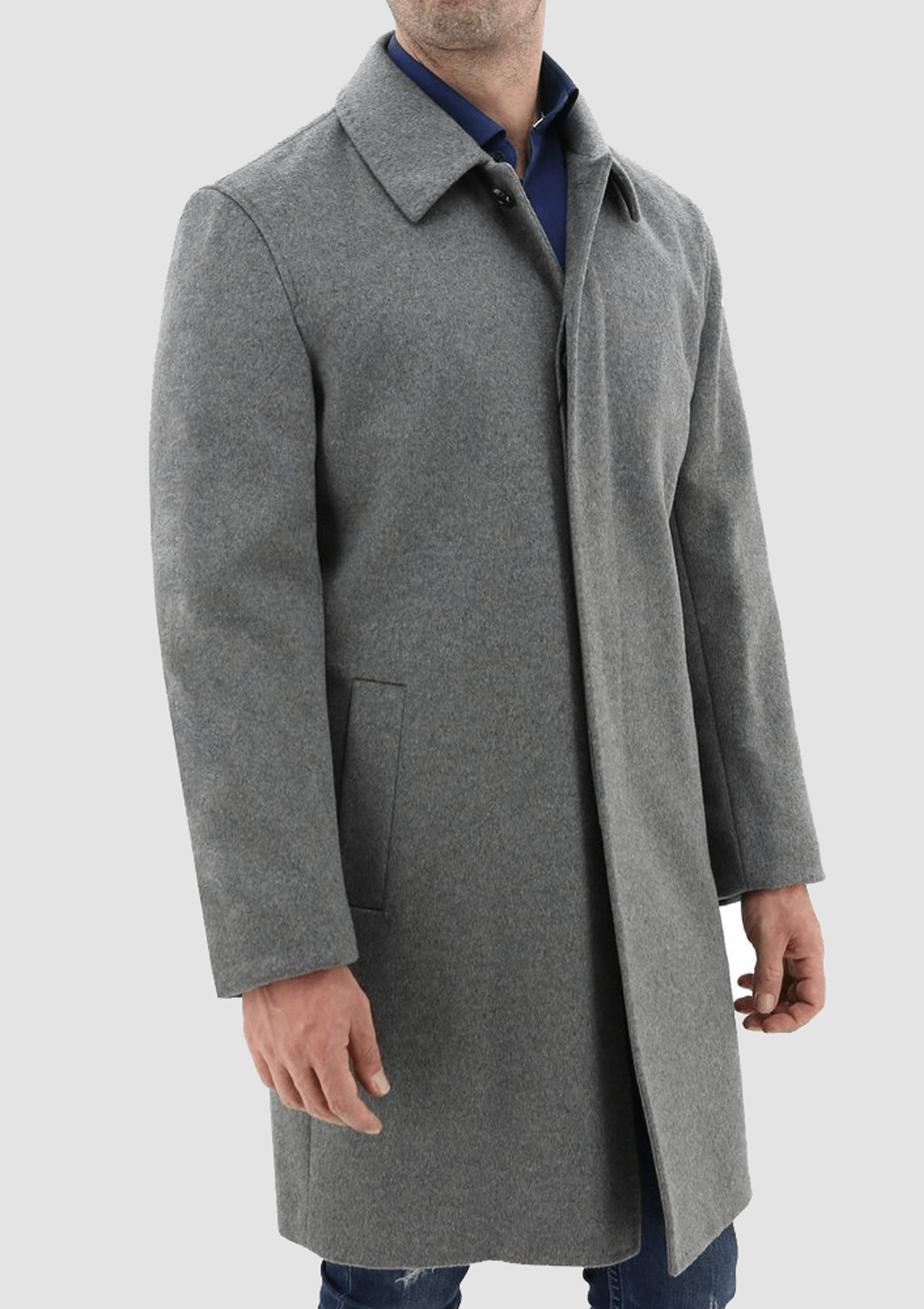 a man wearing a casual weekend look featuring the Daniel Hechter carvell grey cloak winter overcoat over a navy shirt and blue jeans