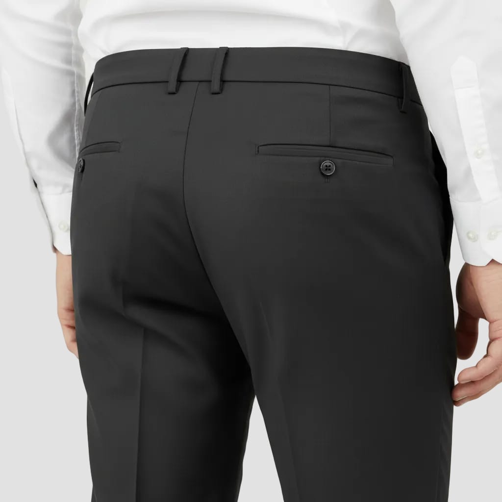 back of black trousers showing back pocket and button
