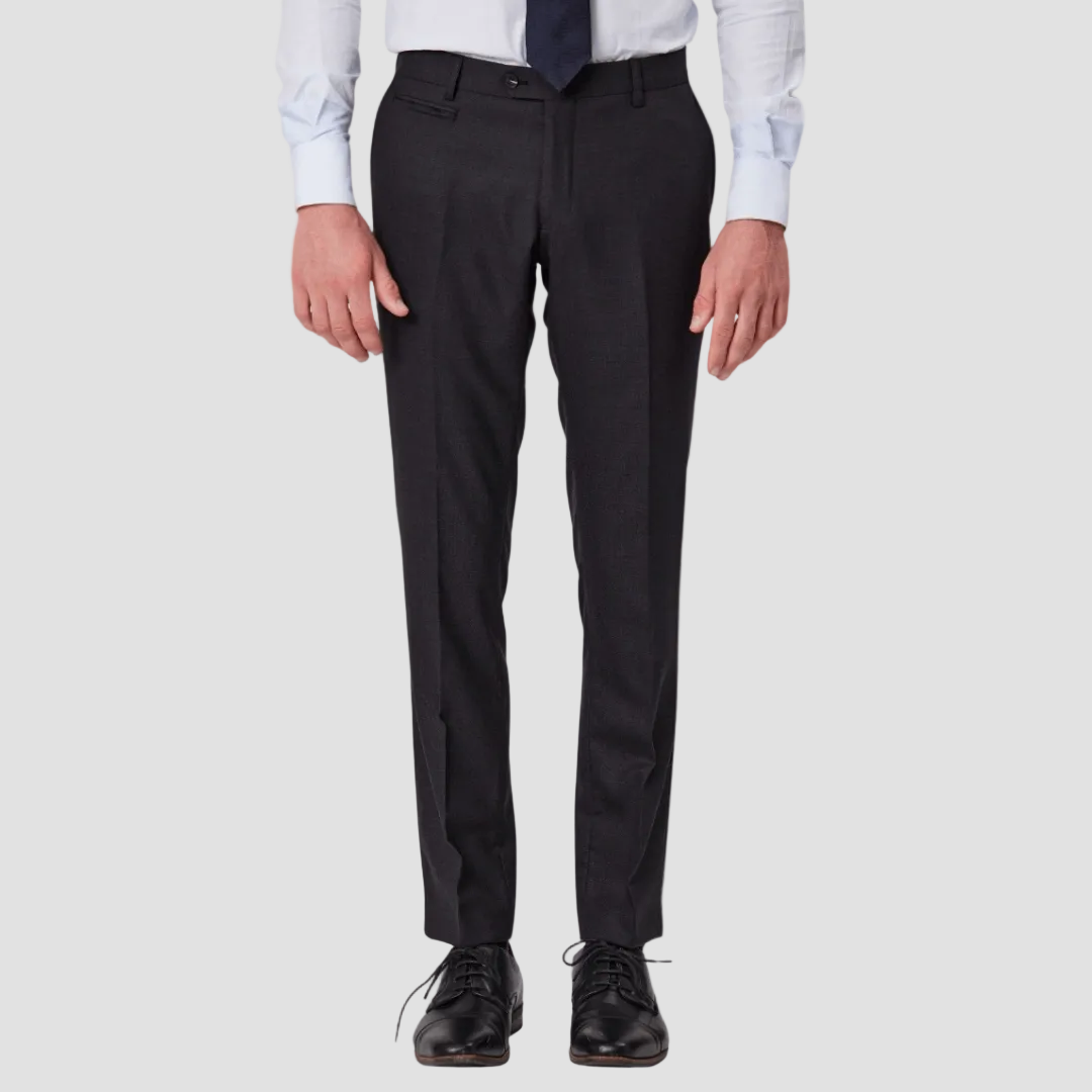 Black dress pants worn with a light blue shirt and black shoes
