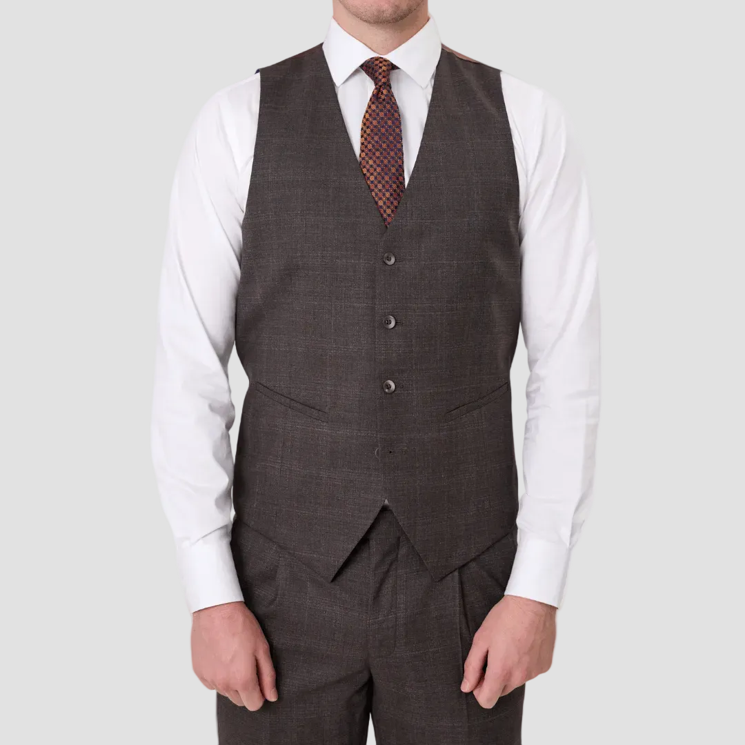 An Australian merino wool brown suit vest over a white shirt with a patterned tie.