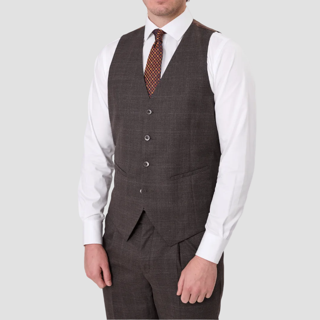 An Australian merino wool brown suit vest over a white shirt with a patterned tie.