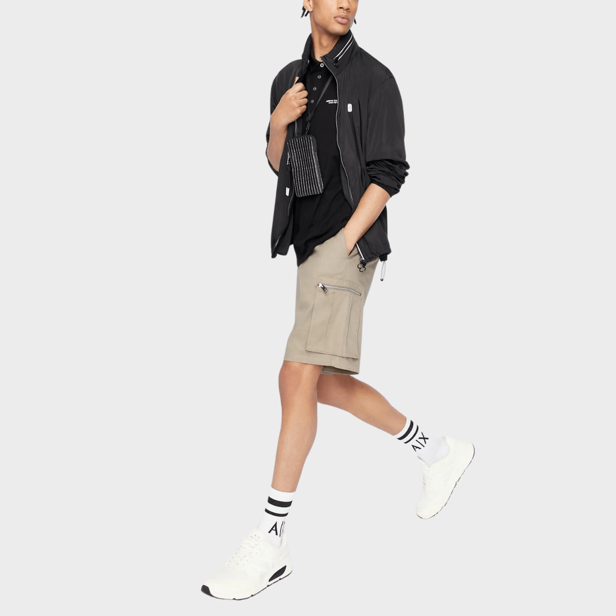 Armani black polo shirt styled with a jacket and cargo pants