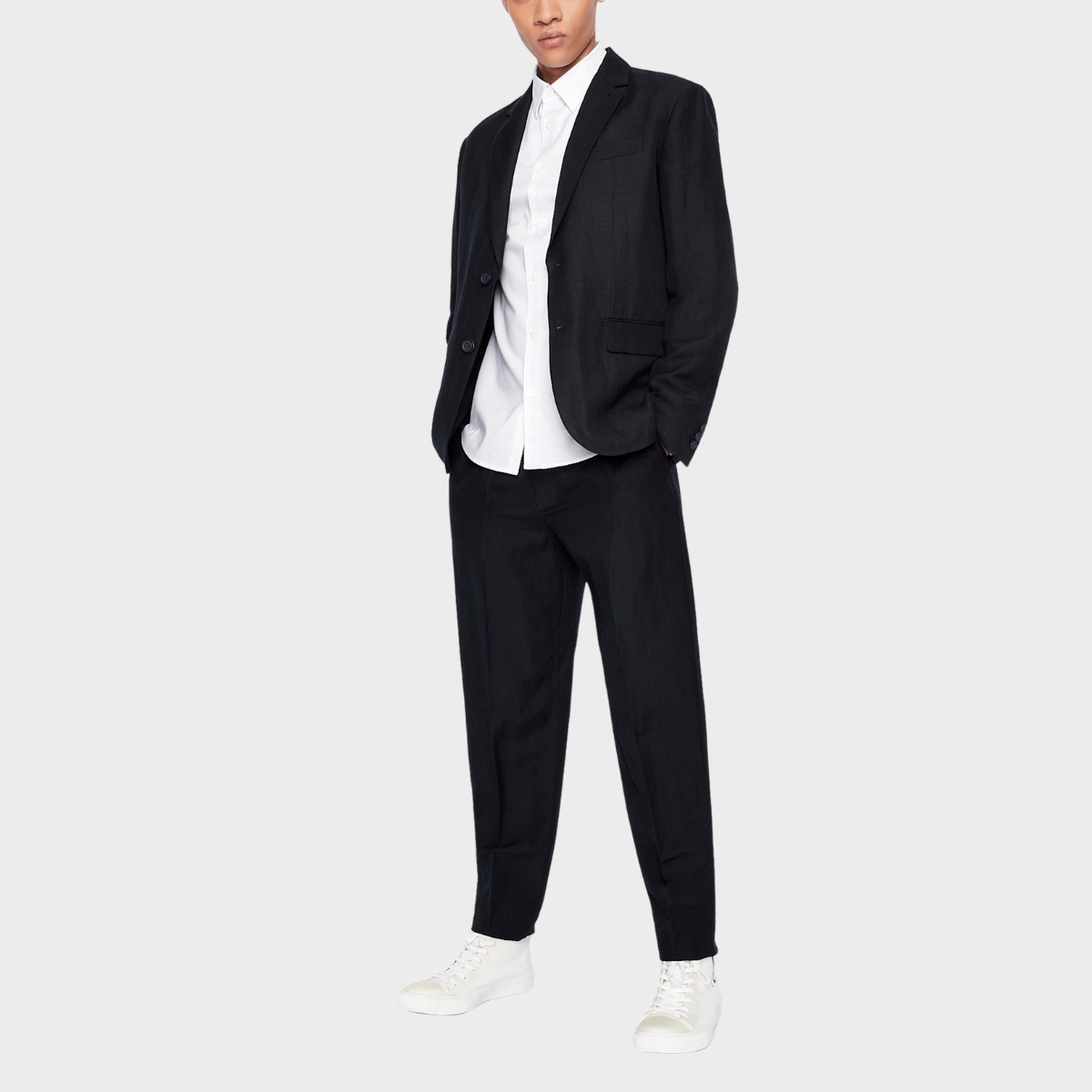 The Armani slim fit business shirt in white oxford fabric paired with a black blazer.