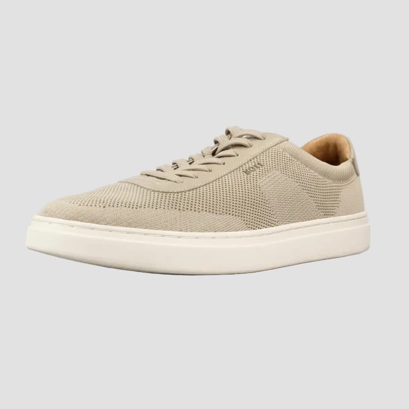 A beige knit lace-up sneaker with a thick white sole, shown from a side profile view on a white background.