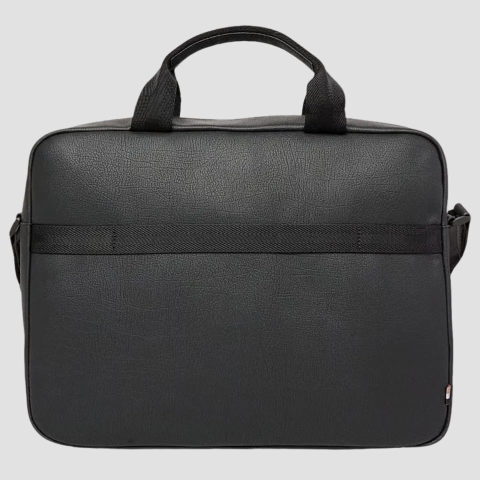 A black pebbled leather briefcase with dual top handles and a horizontal strap detail across the front, shown against a plain light gray background.