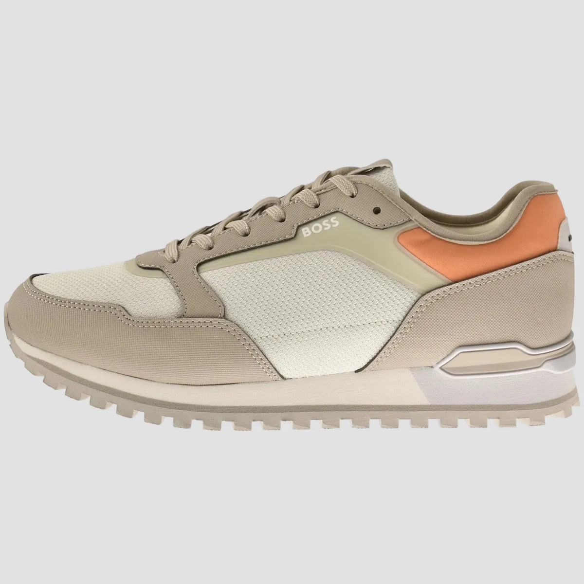 A low-top BOSS sneaker in beige and off-white with a peach-orange accent on the heel, shown from a side profile on a white background.