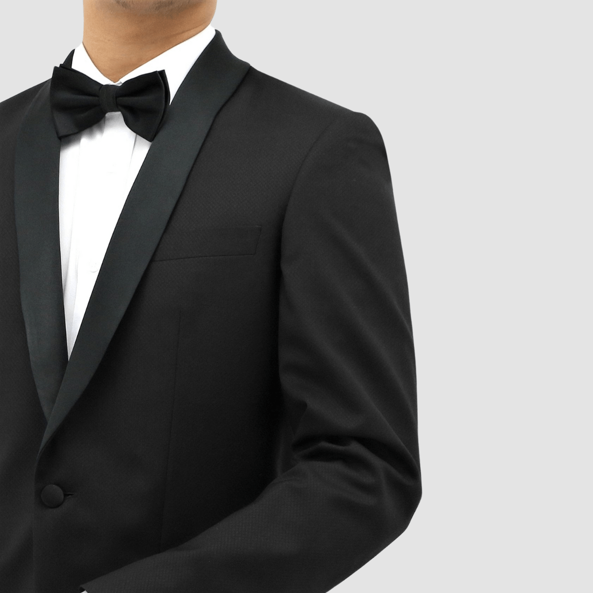 Men’s black shawl‑lapel tuxedo by Boston, crafted in textured merino wool with satin detailing and slim‑fit trousers.