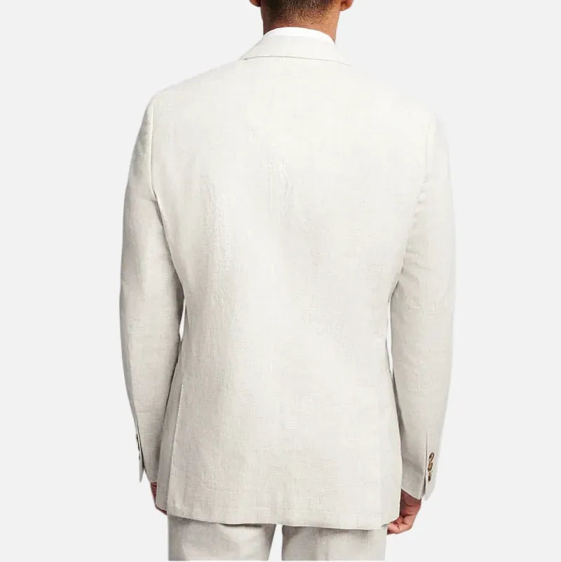 A man viewed from the back wearing a light beige textured linen blazer and matching trousers against a solid light gray background.