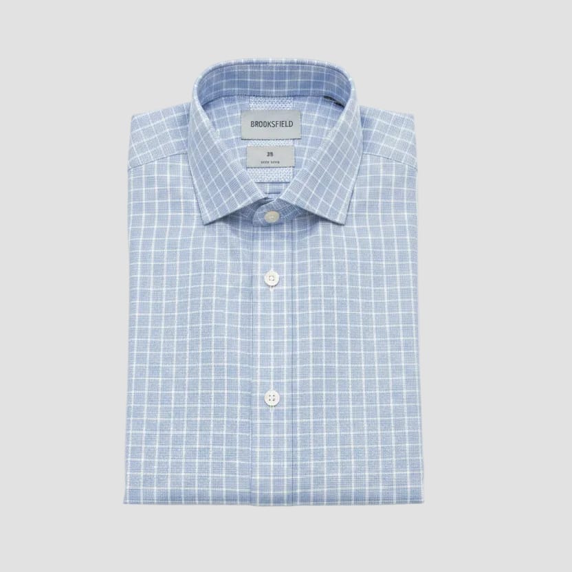 Folded light blue checkered shirt with 'Brockfield' label on a light gray background