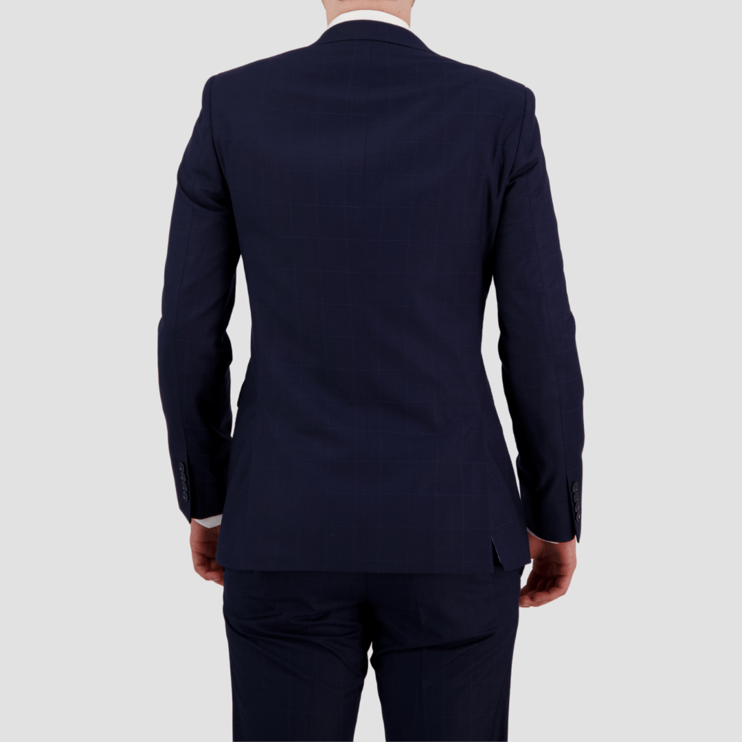 Bruton’s Abram Cornerstone Navy Suit—slim fit jacket and Jesse trouser in check fabric.