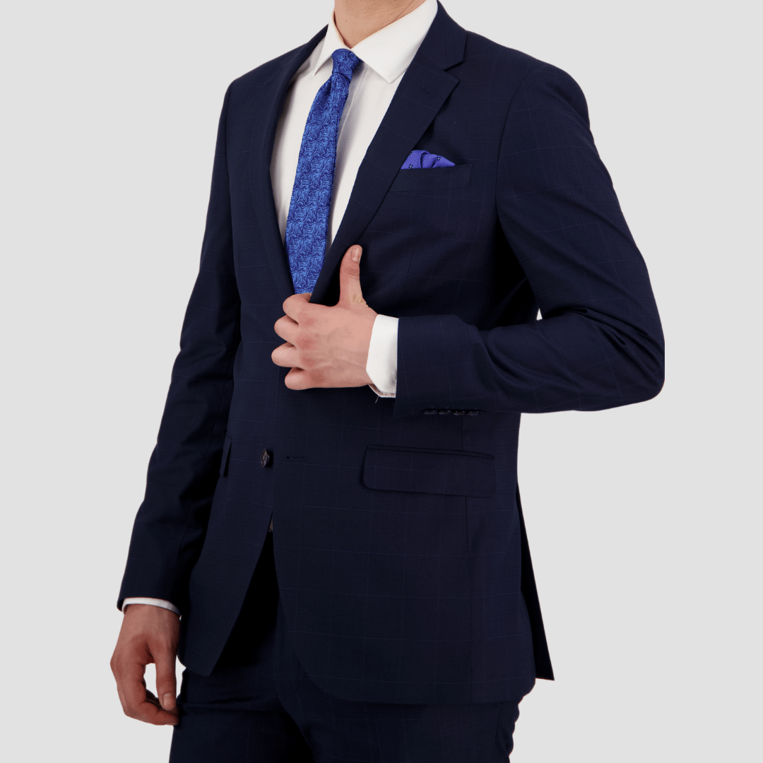 Bruton’s Abram Cornerstone Navy Suit—slim fit jacket and Jesse trouser in check fabric.