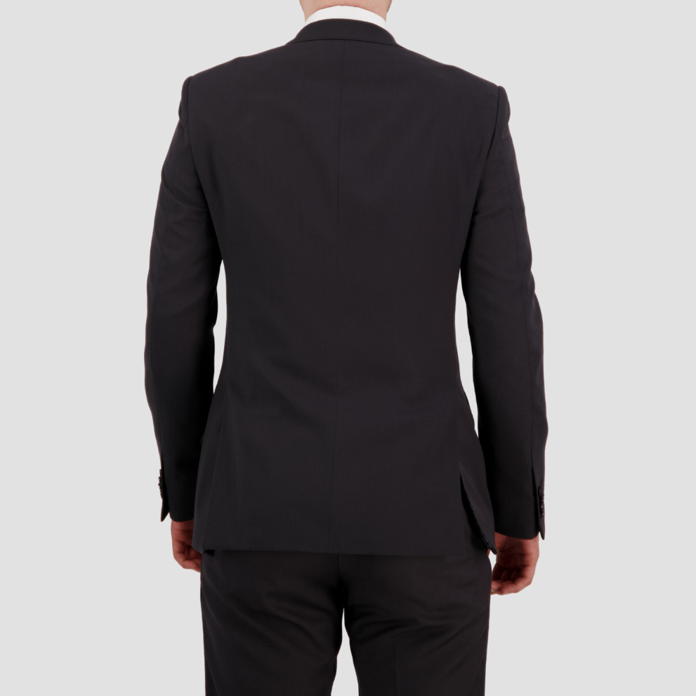 Bruton’s David Keystone slim‑fit charcoal suit with performance finish.