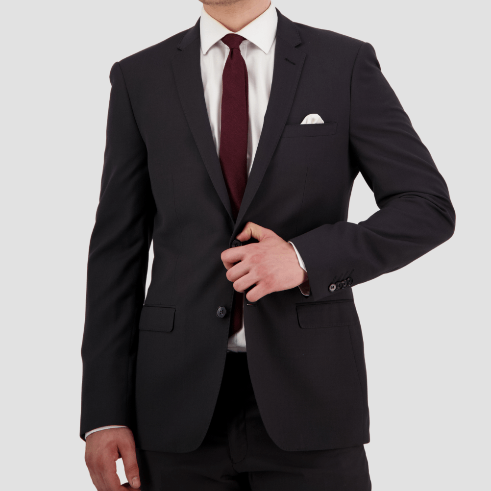 Bruton’s David Keystone slim‑fit charcoal suit with performance finish.