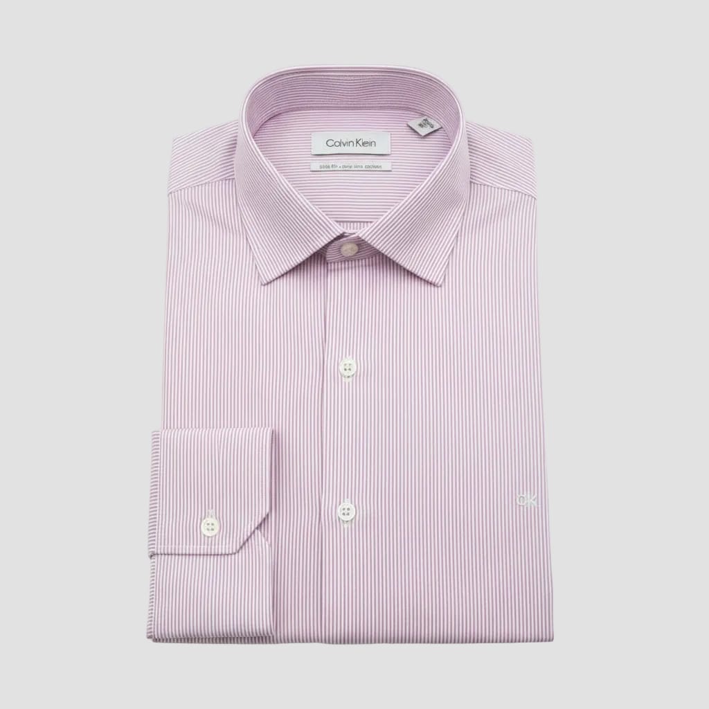 Pink striped dress shirt with Calvin Klein labels on a clear plastic sheet.