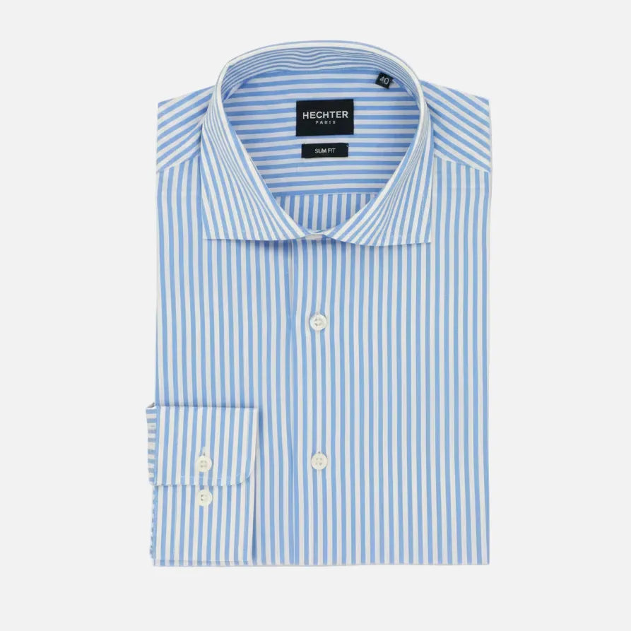 A folded light blue and white striped dress shirt with a pointed collar, button-down front, and a single-button cuff, shown on a plain white background. The neck label reads 'HECHTER PARIS'.