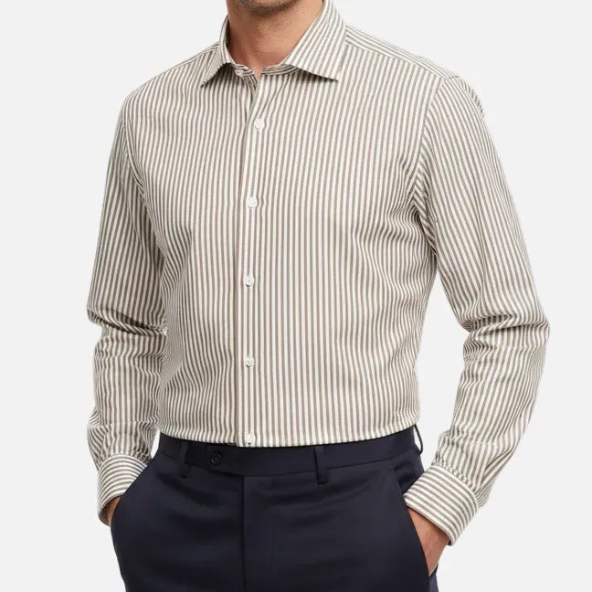 A folded Hechter Paris slim fit dress shirt with vertical beige and white stripes, featuring a pointed collar, white buttons, and a folded cuff.