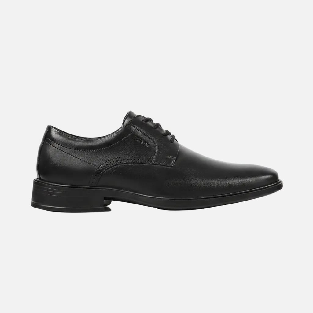 Black leather dress shoe on a white background